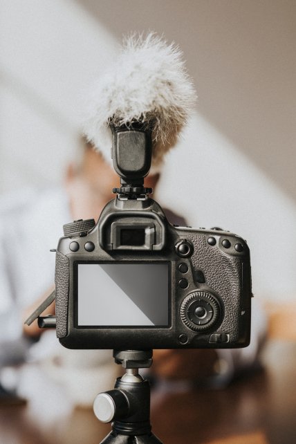 Digital camera with a microphone windshield